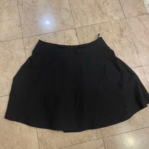 Black pleated mini skirt, size L. Stretchy material